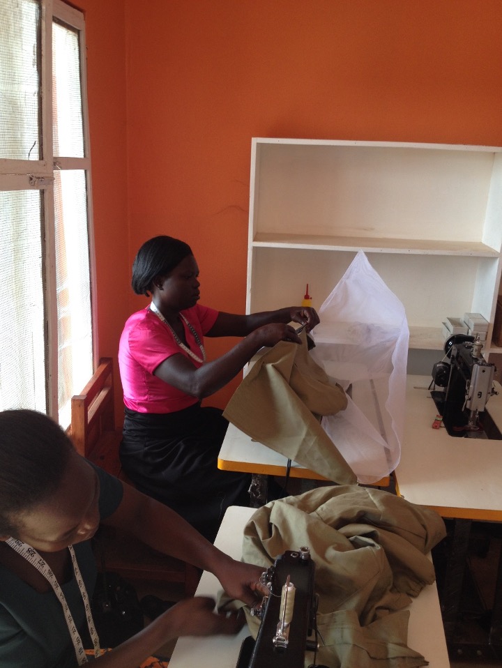 Women at work joining the bee suits and vail.