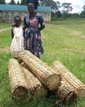 A Visually impaire women receive five bamboo bee hives