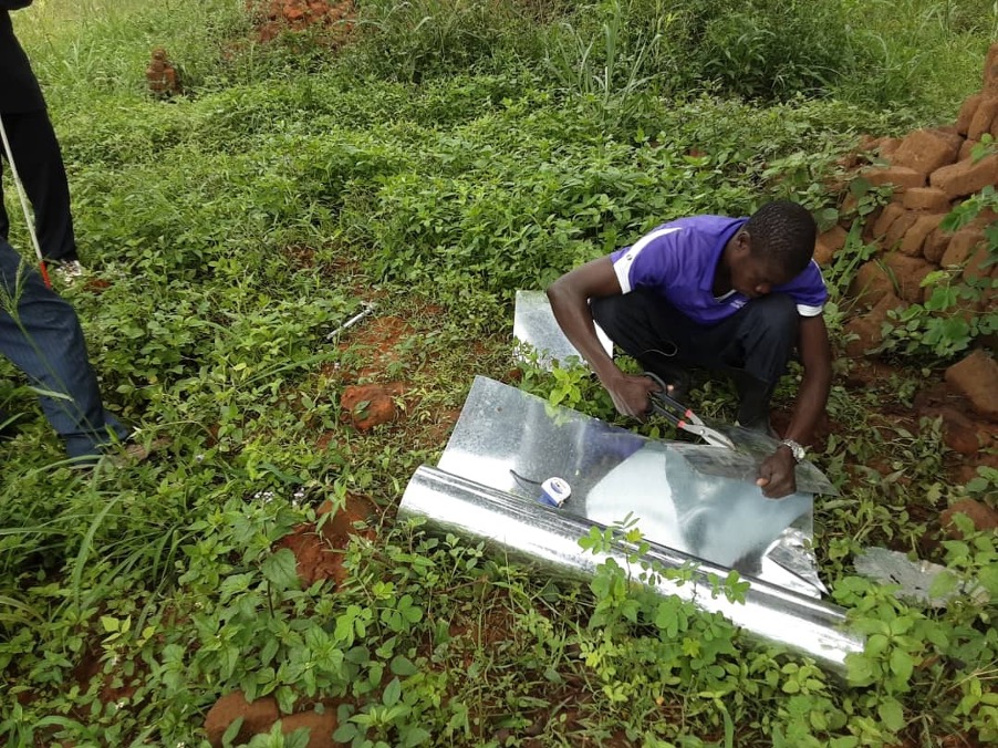 Preparing iron sheet to put as lid by the guide of a blind bee farmer